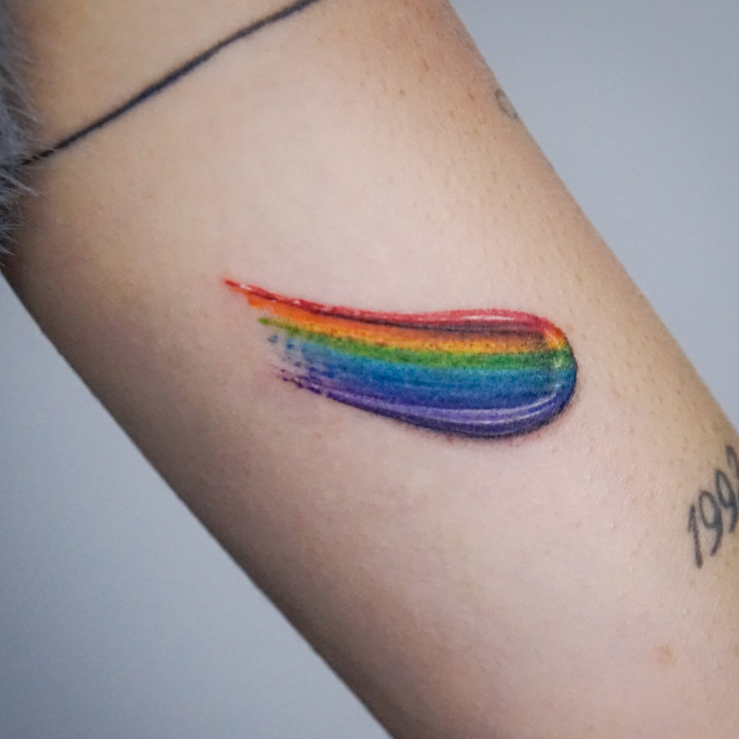 Rainbow streak dotwork tattoo on the forearm by Gemma✨ Realismtattoo