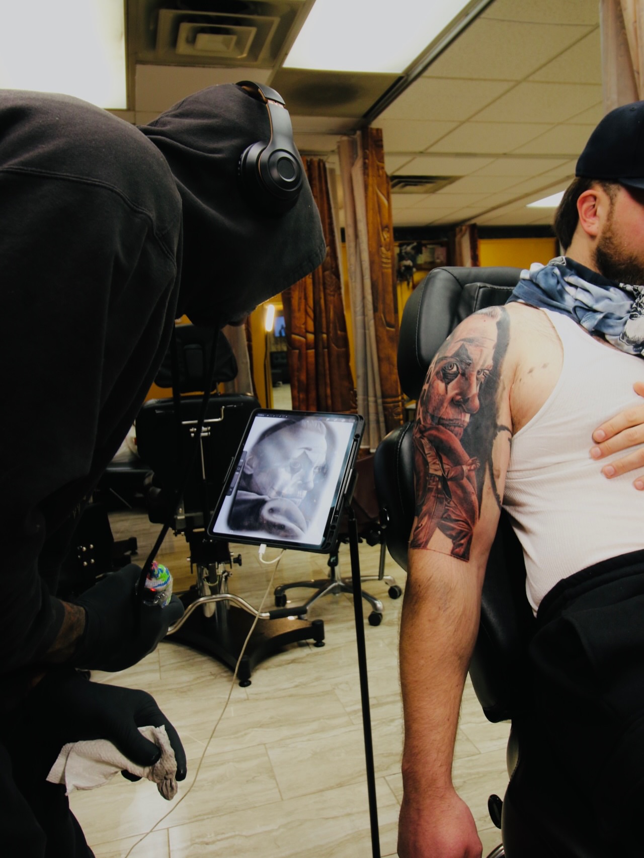 Portrait realism tattoo on the upper arm by Quinten Harper