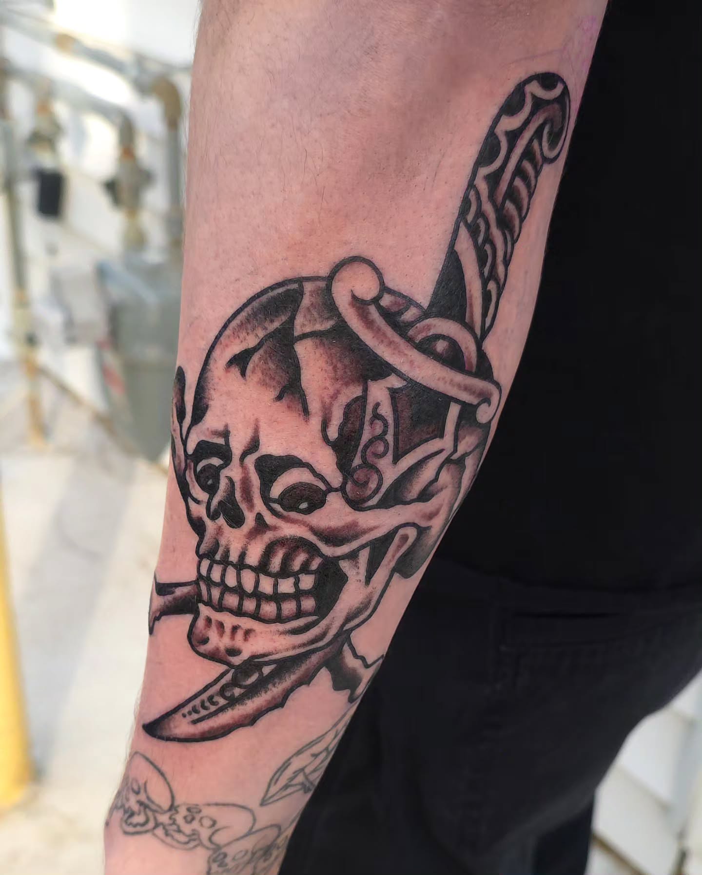 Skull and dagger American traditional tattoo on the forearm by J. Kirsch New Jersey Tattoo Artist