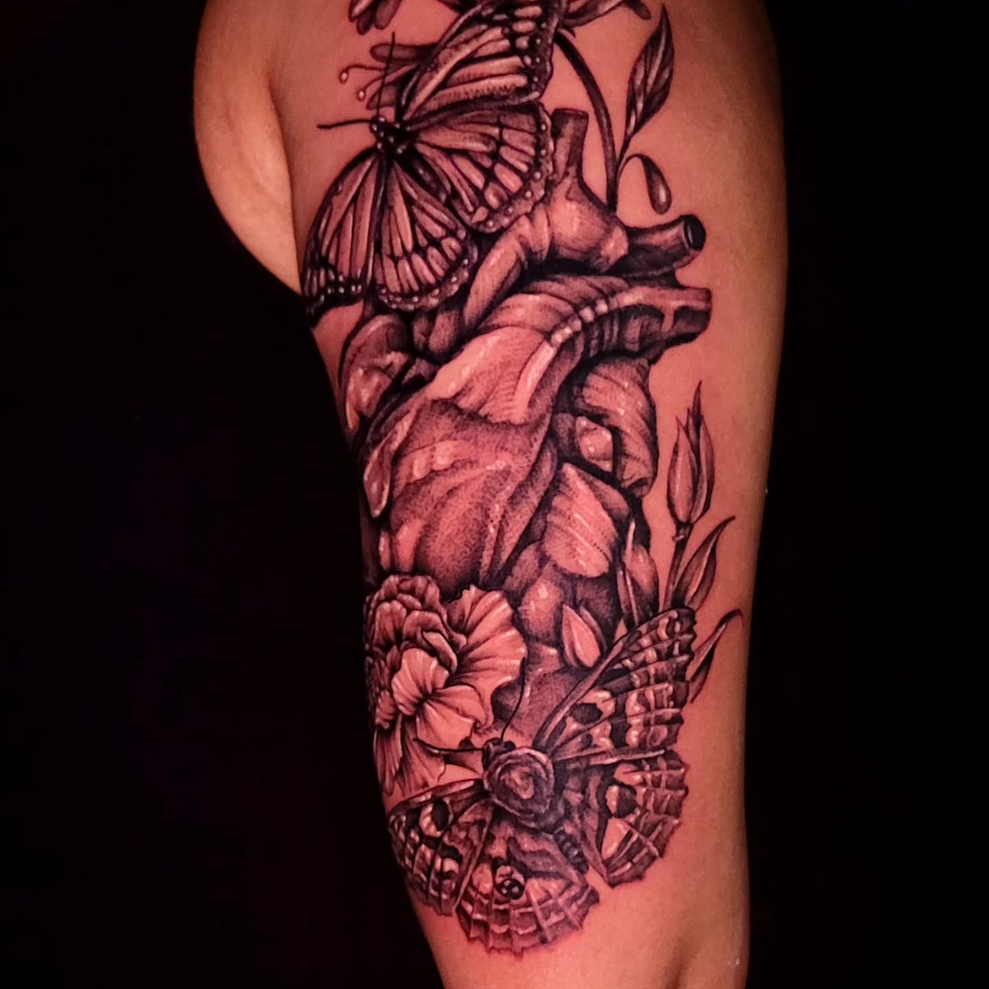 Heart and butterflies realism tattoo on the forearm by Tyler Monty