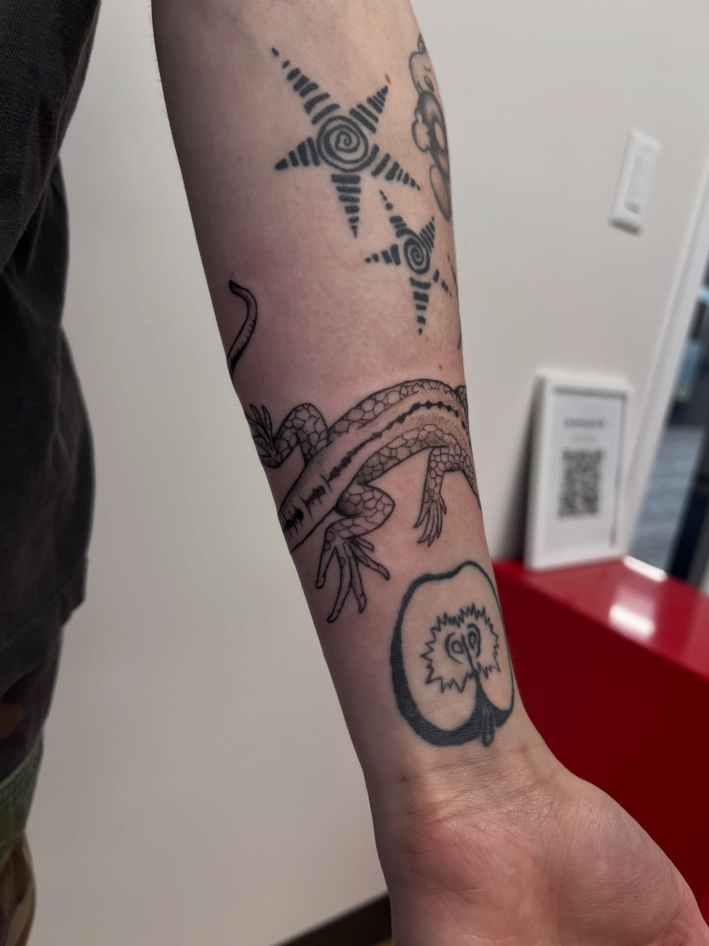 Lizard and owl black and grey tattoo on the forearm by rachel