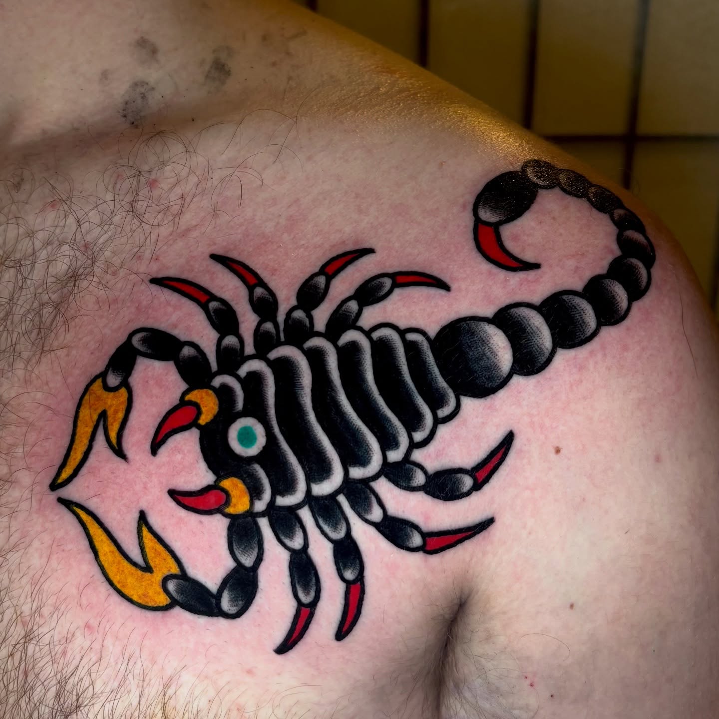 Scorpion American traditional tattoo on the shoulder by Santo Zelaya, San Francisco, California