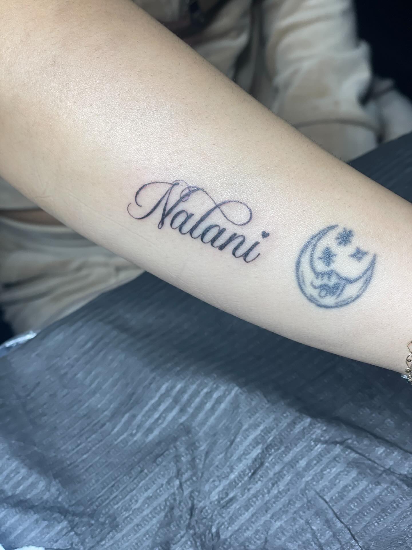 Nalani lettering script tattoo on the forearm by 😈headhuncho😈