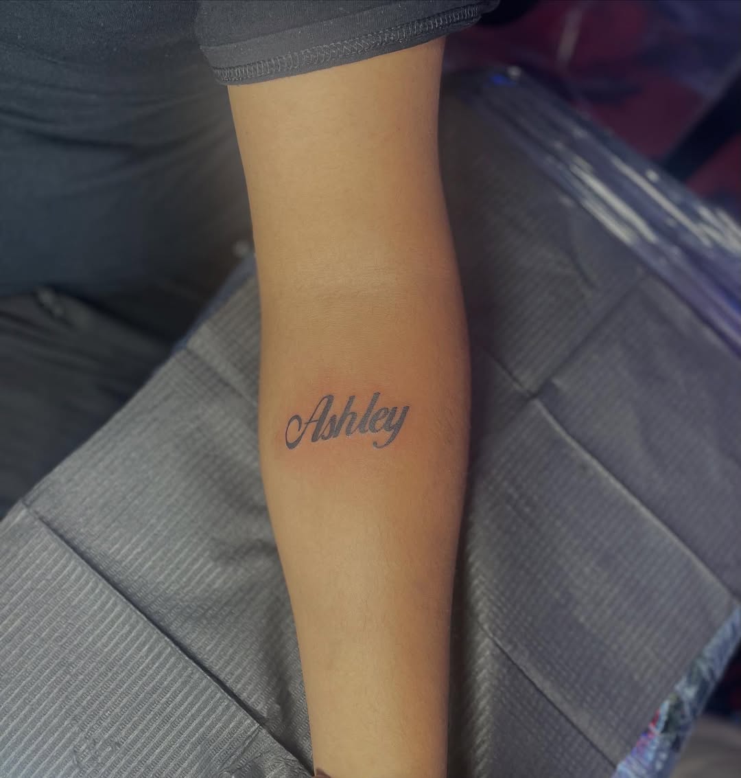 Name tattoo lettering tattoo on the forearm by 😈headhuncho😈