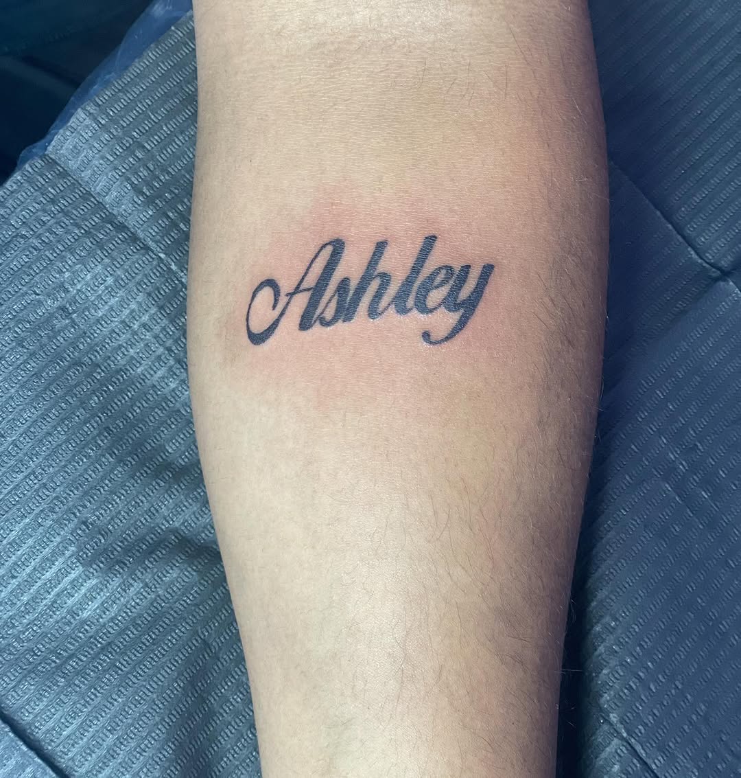 Ashley name lettering tattoo on the forearm by 😈headhuncho😈