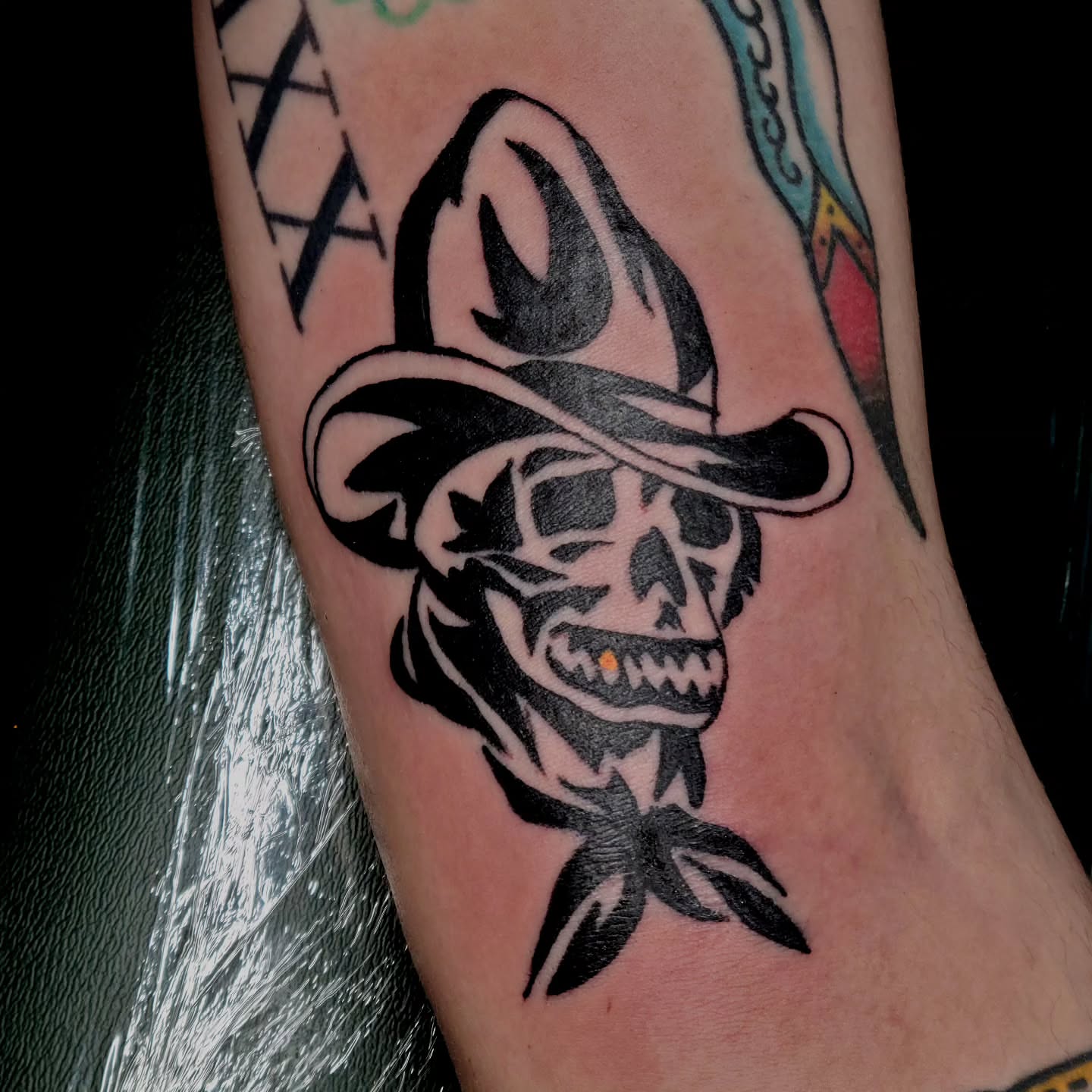 Cowboy skull American traditional tattoo on the forearm by Adam Lunoe, Seattle, Washington