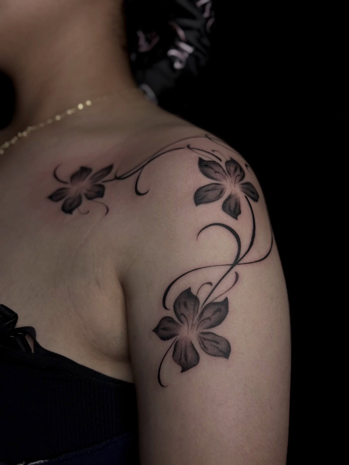 Flowers black and grey tattoo on the shoulder by Emersyn DeLuna