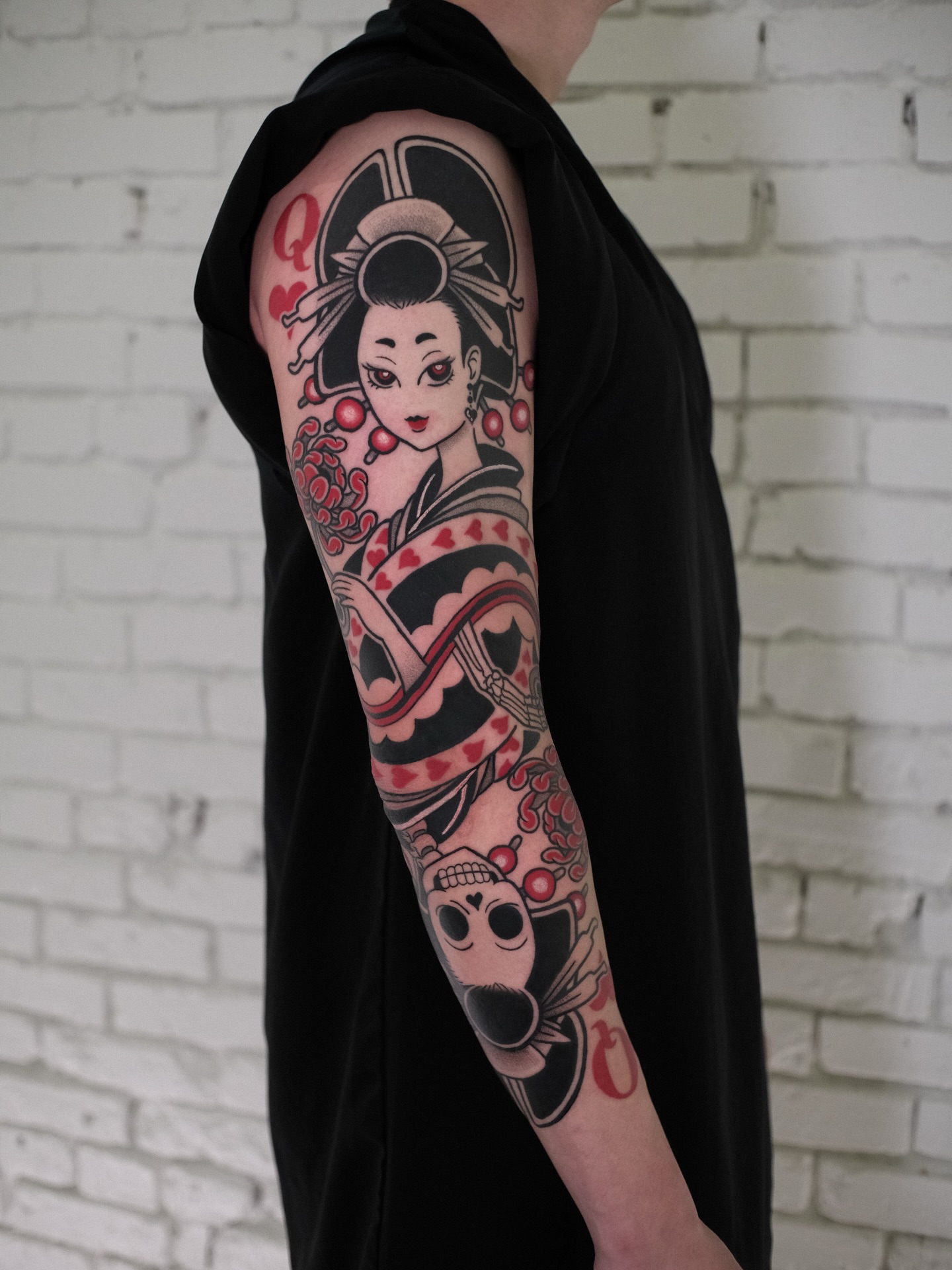 Geisha and skull American traditional tattoo on the forearm by seattle tattoo artist
