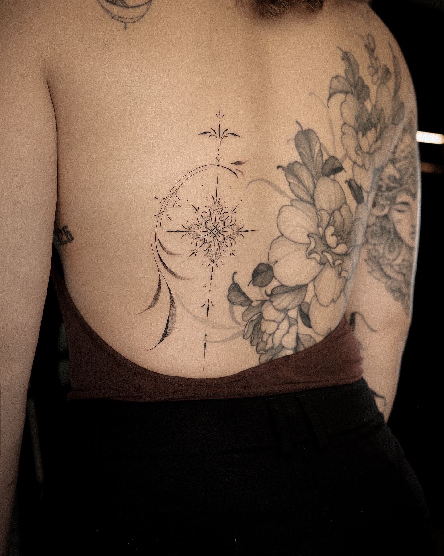 Floral compass geometric tattoo on the back by Easy