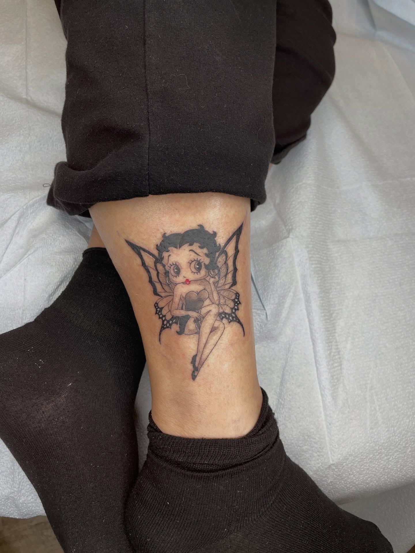 Betty Boop fairy black and grey tattoo on the forearm by Melissa Rose Moya