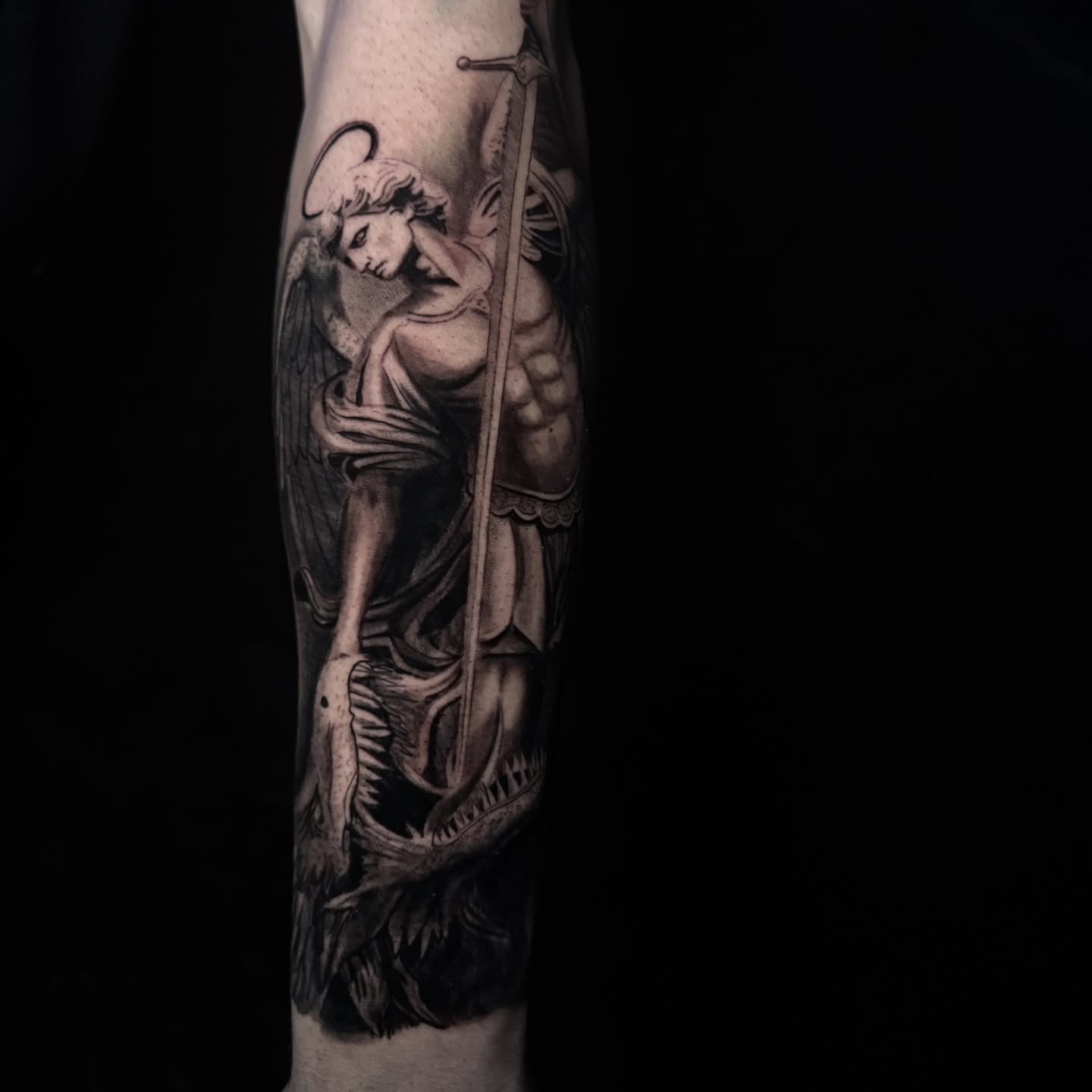 Angel with sword black and grey tattoo on the forearm by Elian Sanchez Austin Tx. Tattoo Artist