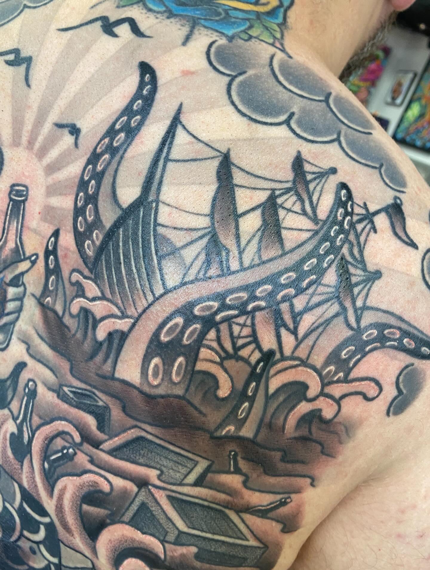 Ship and octopus American traditional tattoo on the shoulder by Kellsey Mull