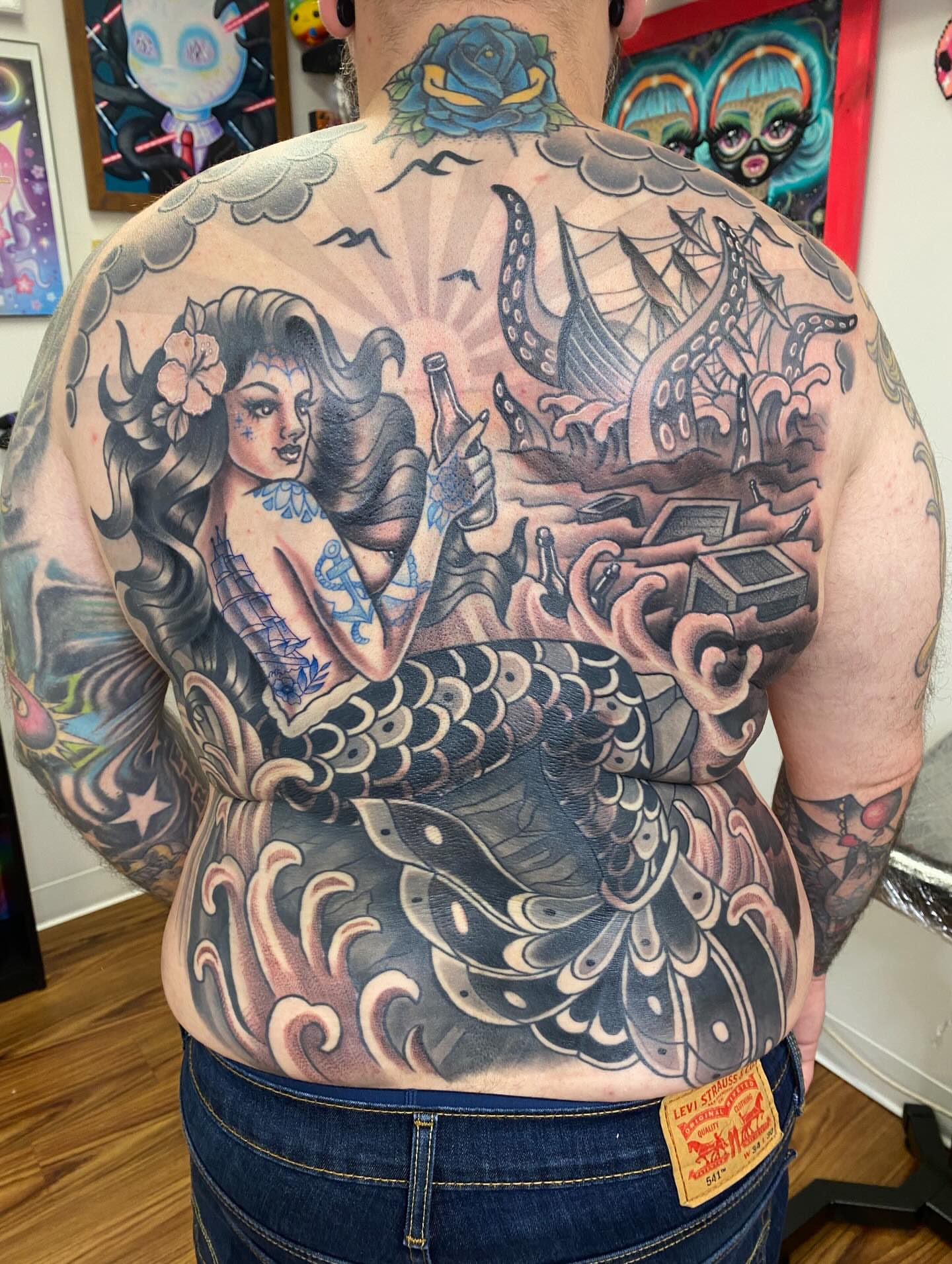 Mermaid and kraken American traditional tattoo on the back by Kellsey Mull