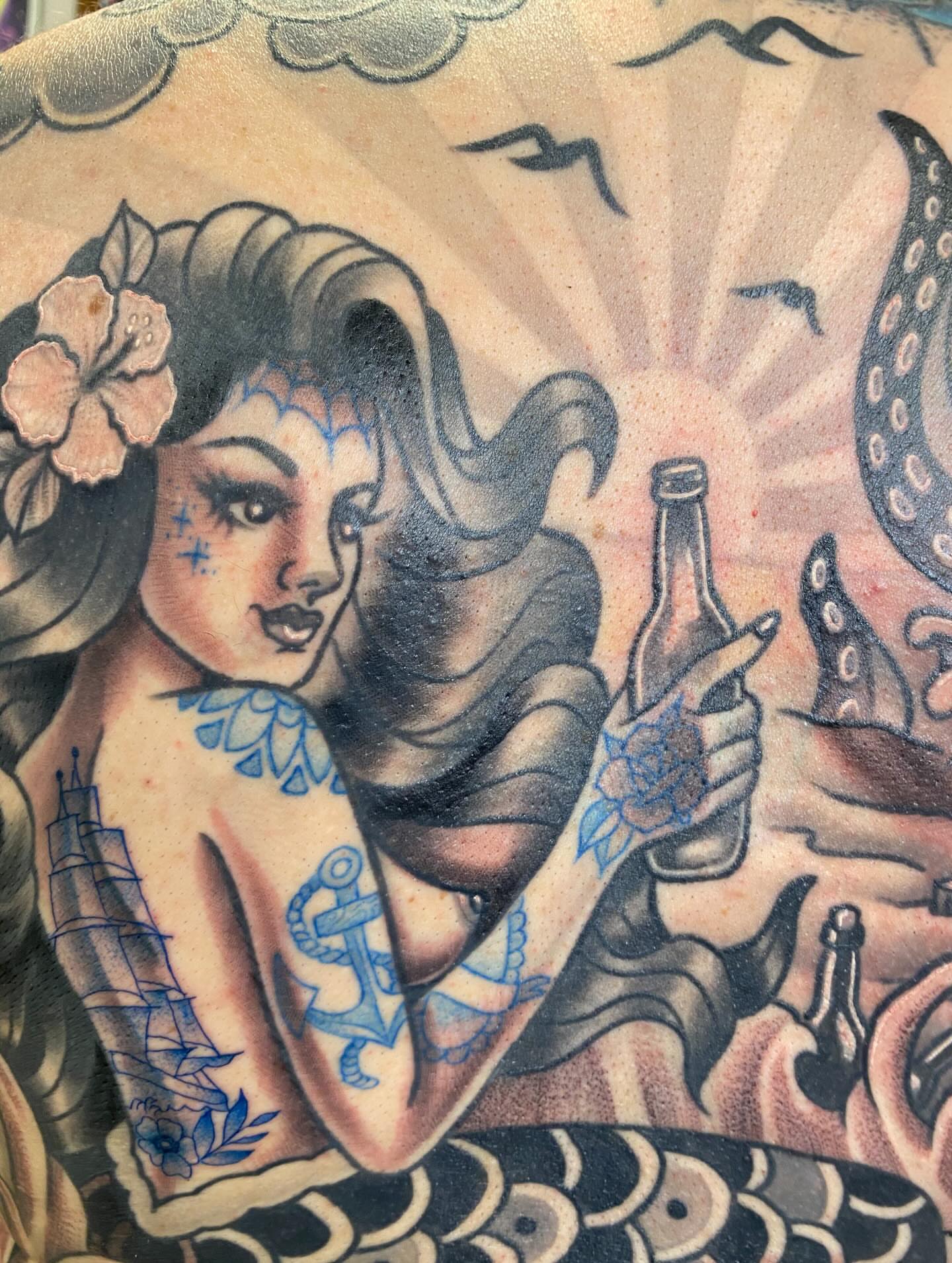Woman with bottle American traditional tattoo on the torso by Kellsey Mull