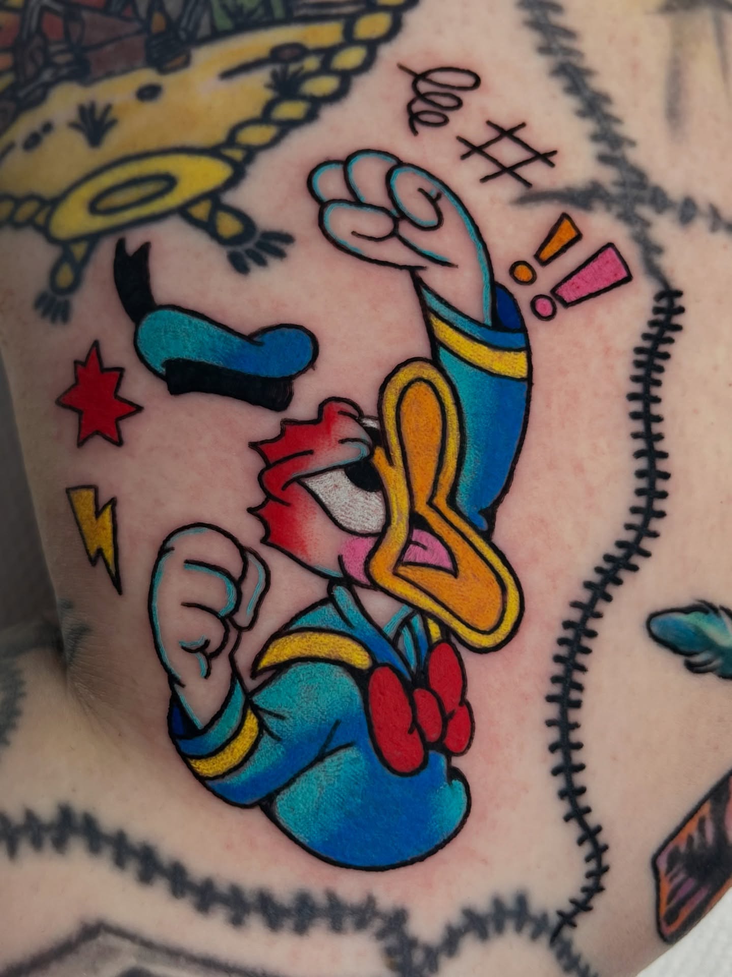 Donald Duck American traditional tattoo on the forearm by Alena McDonald