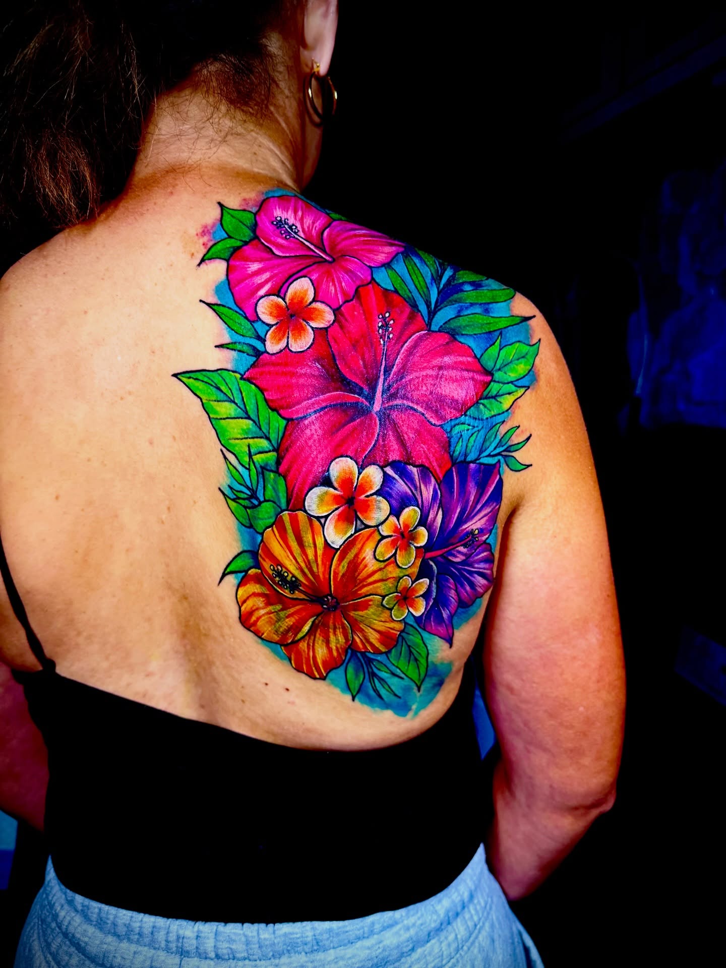 Hawaiian flowers new school tattoo on the back by John Ayson, Murrieta, California