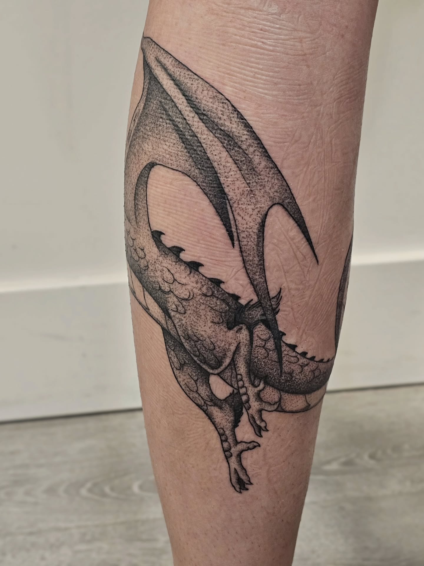 Dragon dotwork tattoo on the forearm by Kylie Lund