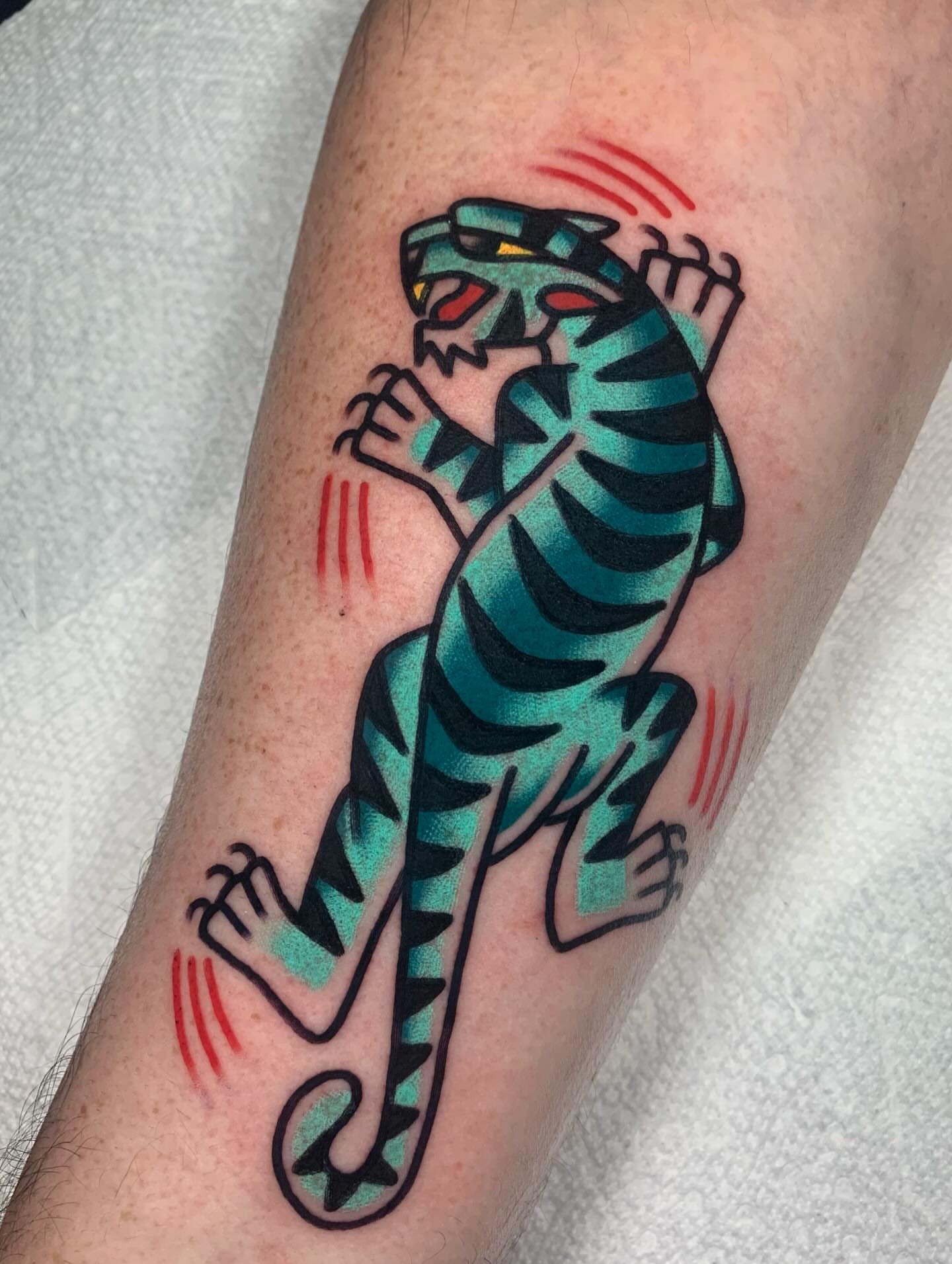 Tiger American traditional tattoo on the forearm by Shawn VanKirk
