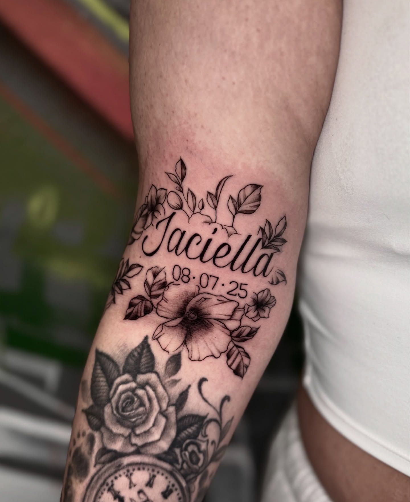 Name and date black and grey tattoo on the forearm by Jess