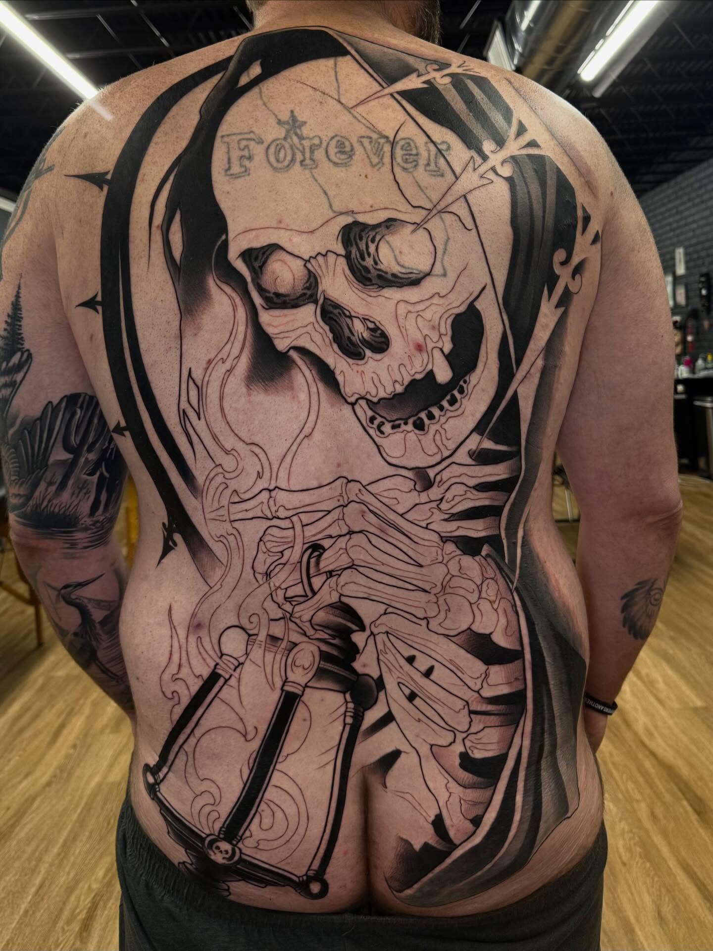 Skeleton with bow and arrow realism tattoo on the back by Bryan ๐ฅ Loggins, Baton Rouge, Louisiana
