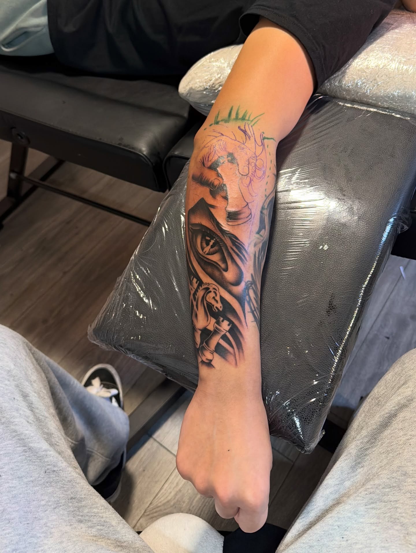 Eye and lion realism tattoo on the forearm by InkbyCasillas