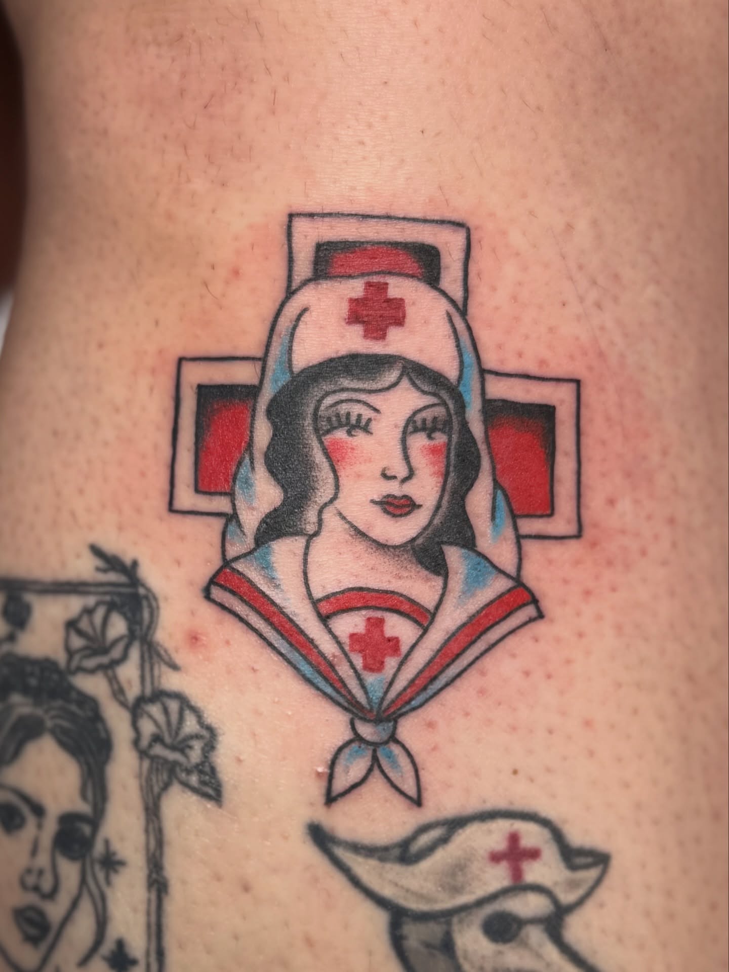 Nurse American traditional tattoo on the forearm by Devin Derbes