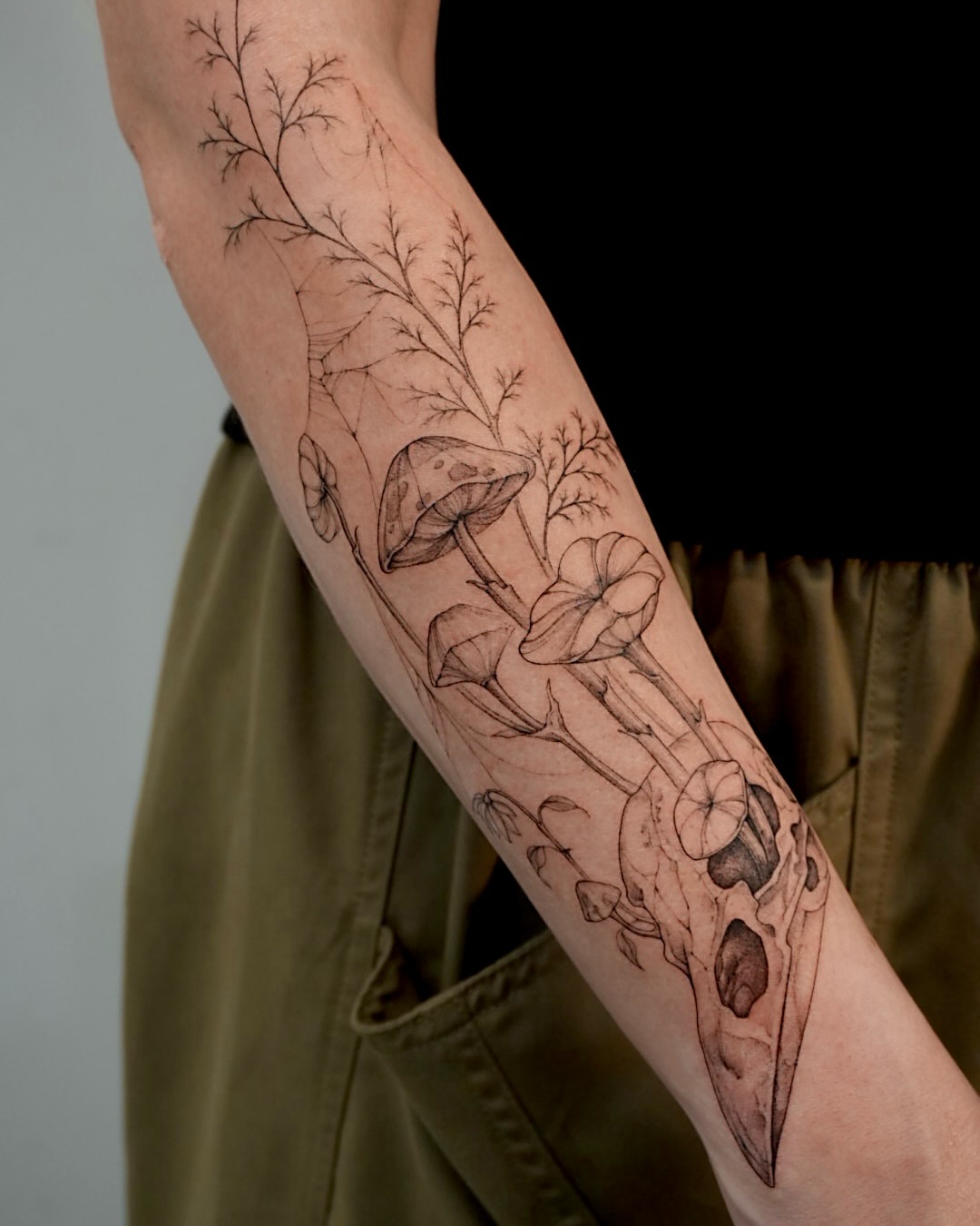 Mushroom and skull realism tattoo on the forearm by Hyn[hin]