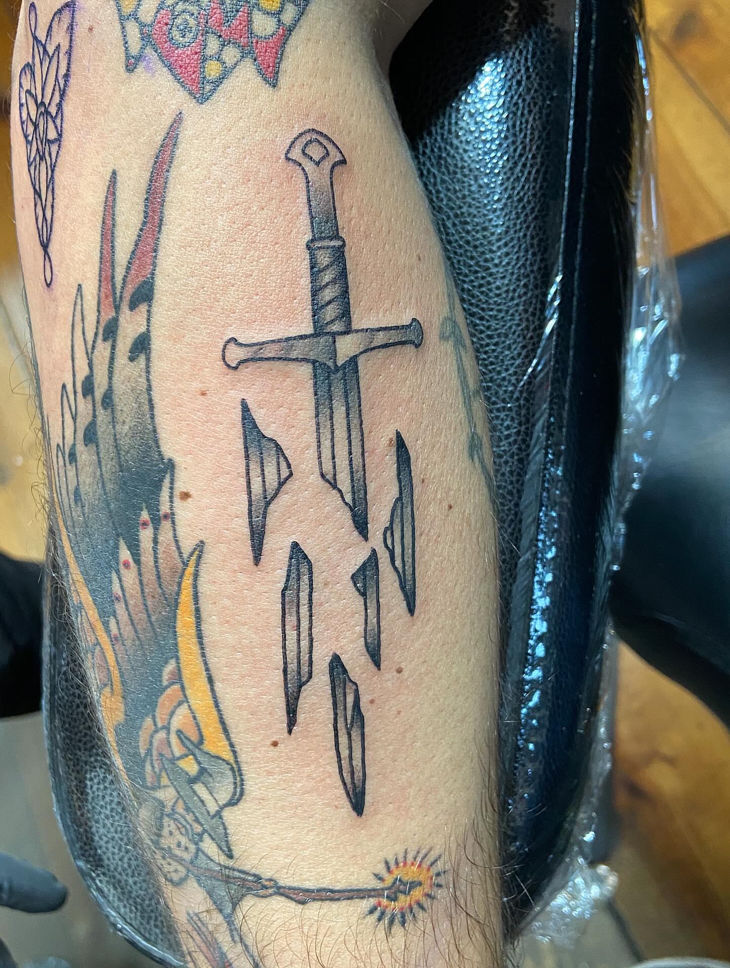 Sword and shards American traditional tattoo on the forearm by Tattoos by Dale Hupke, Lebanon, Ohio