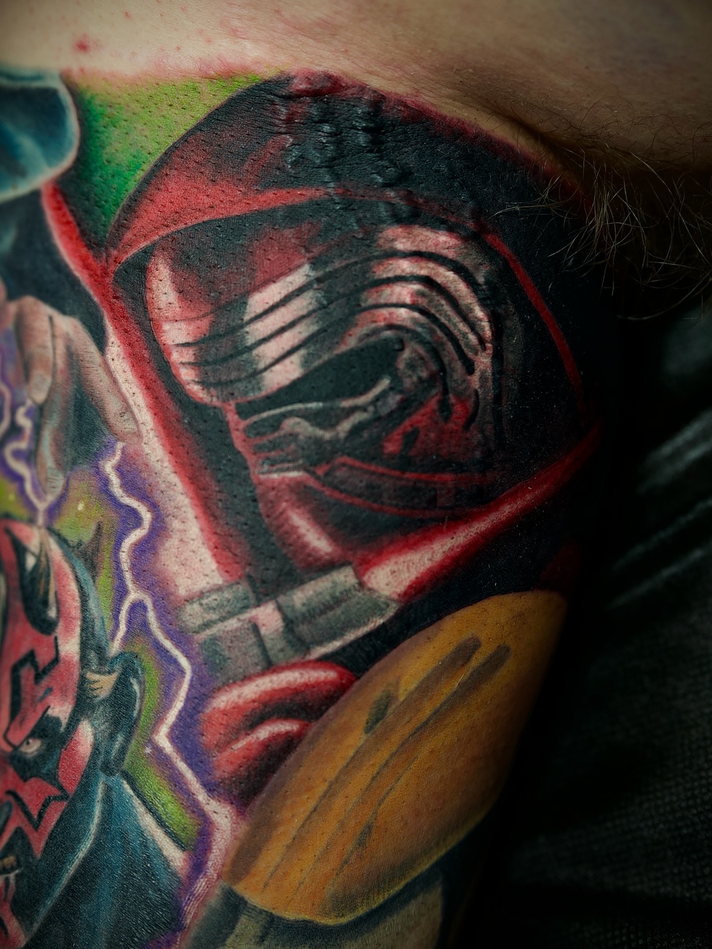 Kylo Ren helmet realism tattoo on the shoulder by Chris Lochbihler