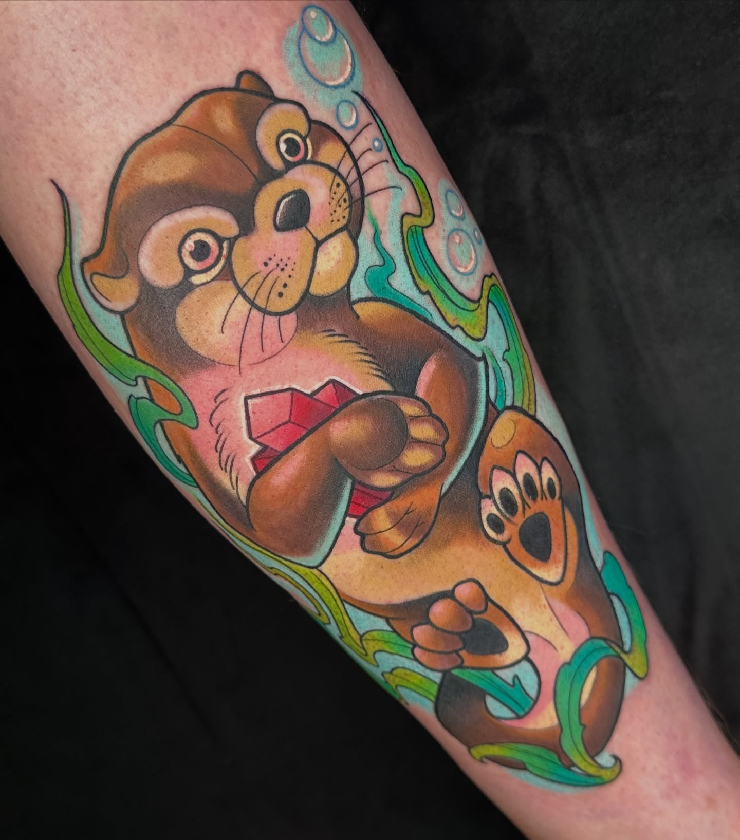Otter new school tattoo on the forearm by B.G. Germershausen