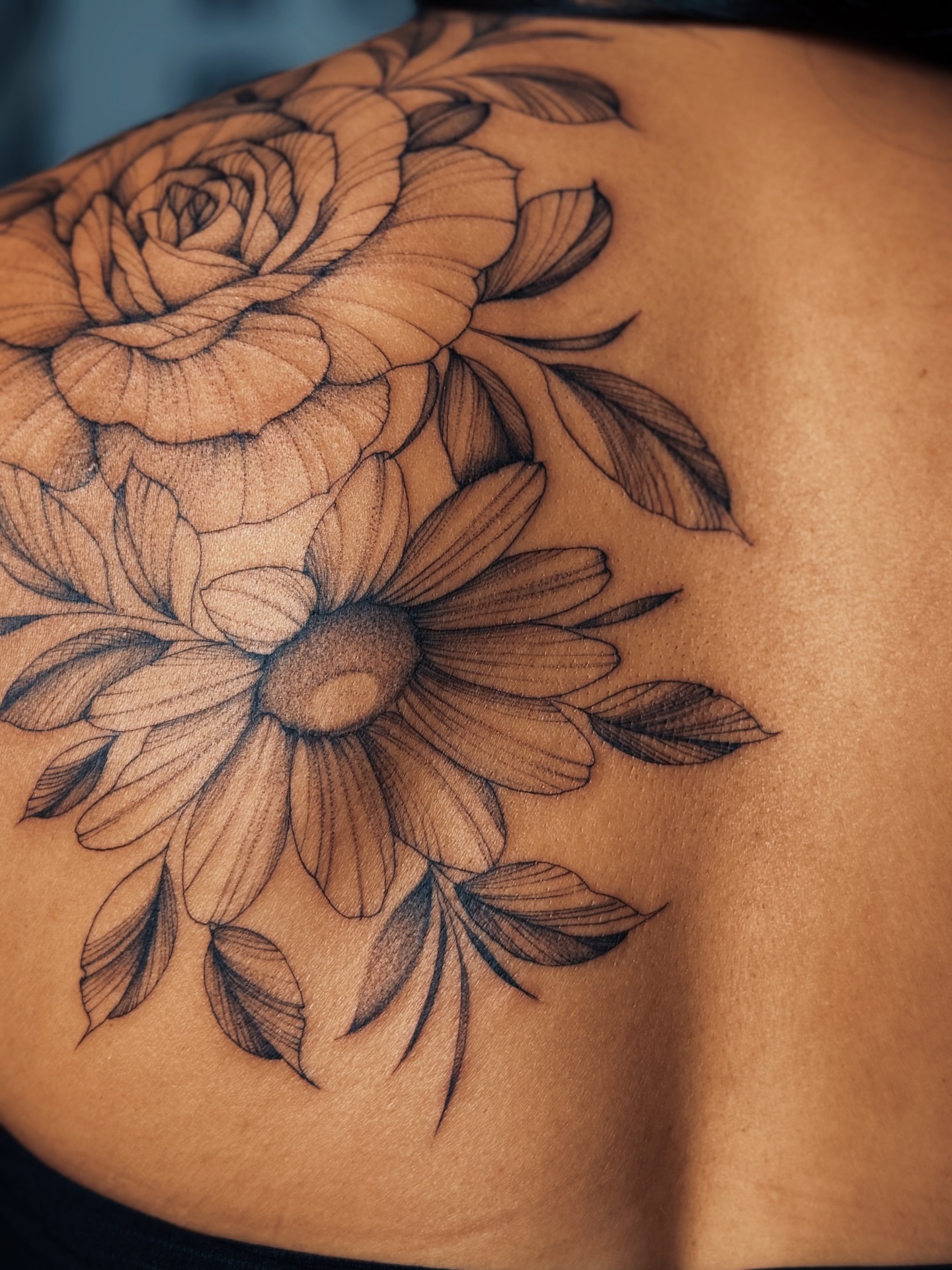 Flower bouquet realism tattoo on the shoulder by Olha Tytarenko