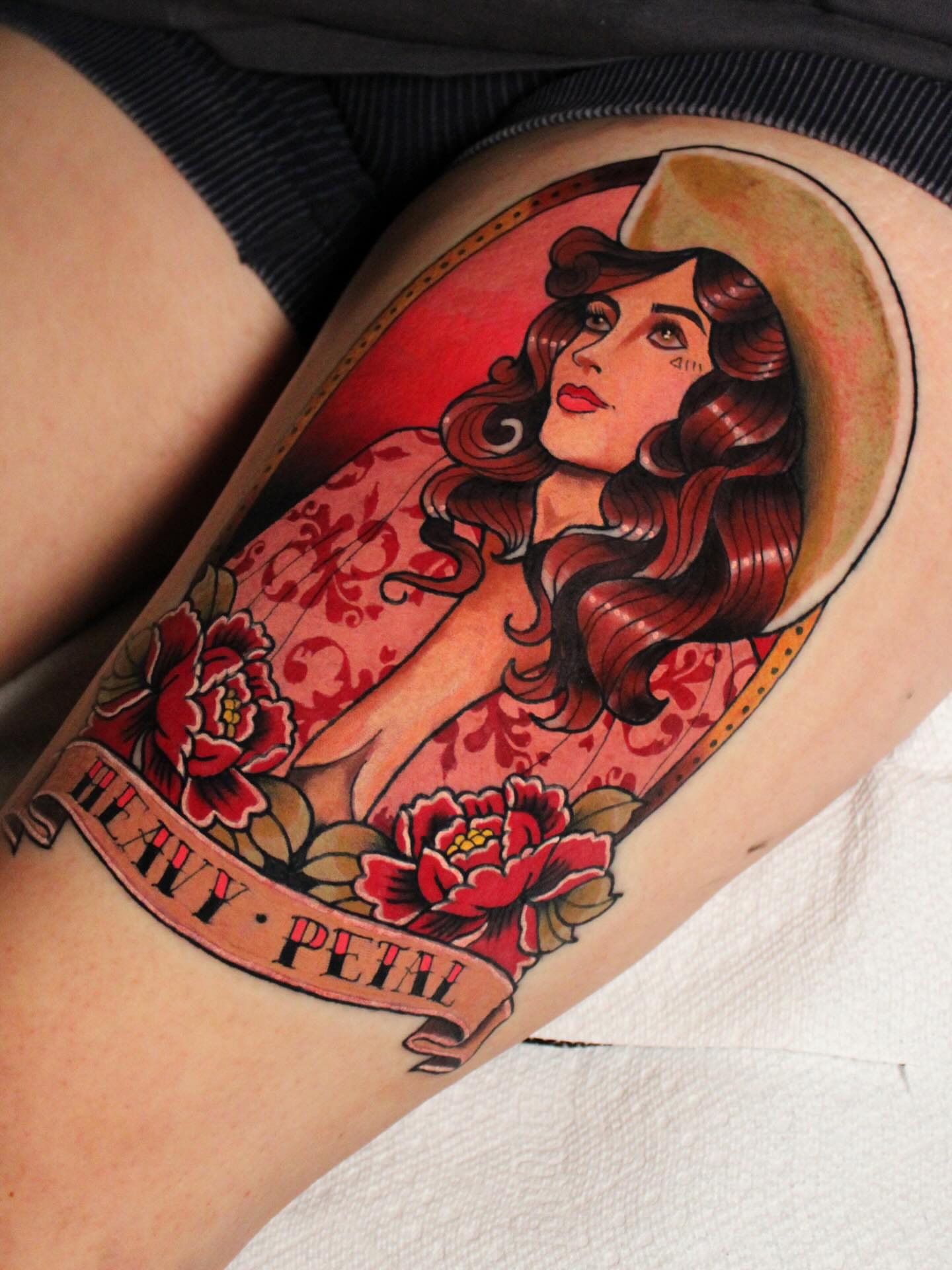 Woman with roses American traditional tattoo on the thigh by Dylan Walker