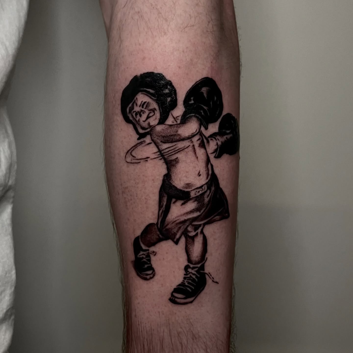 Boxing character black and grey tattoo on the forearm by ˖.𖥔 ݁˖anna hoffman˖ ⊹ ࣪ ˖, Salt Lake City, Utah