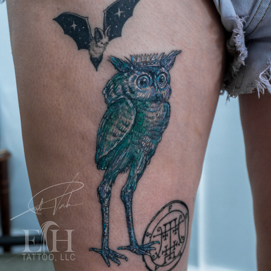 Owl with crown and sigil tattoo on the thigh by Donald Voelker