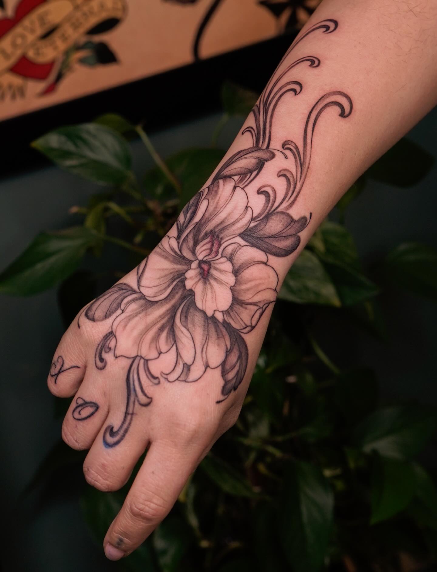 Chrysanthemum black and grey tattoo on the hand by Nicki Yến