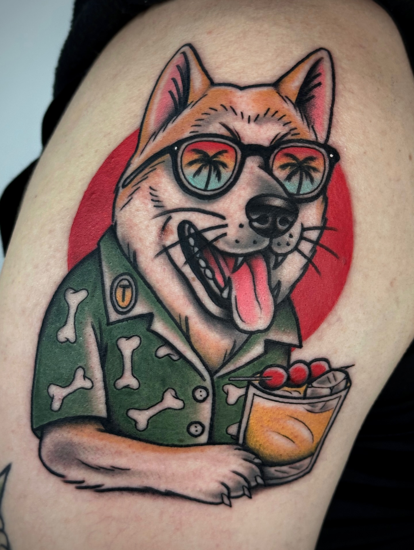 Dog wearing sunglasses American traditional tattoo on the shoulder by Black and color tattoo!