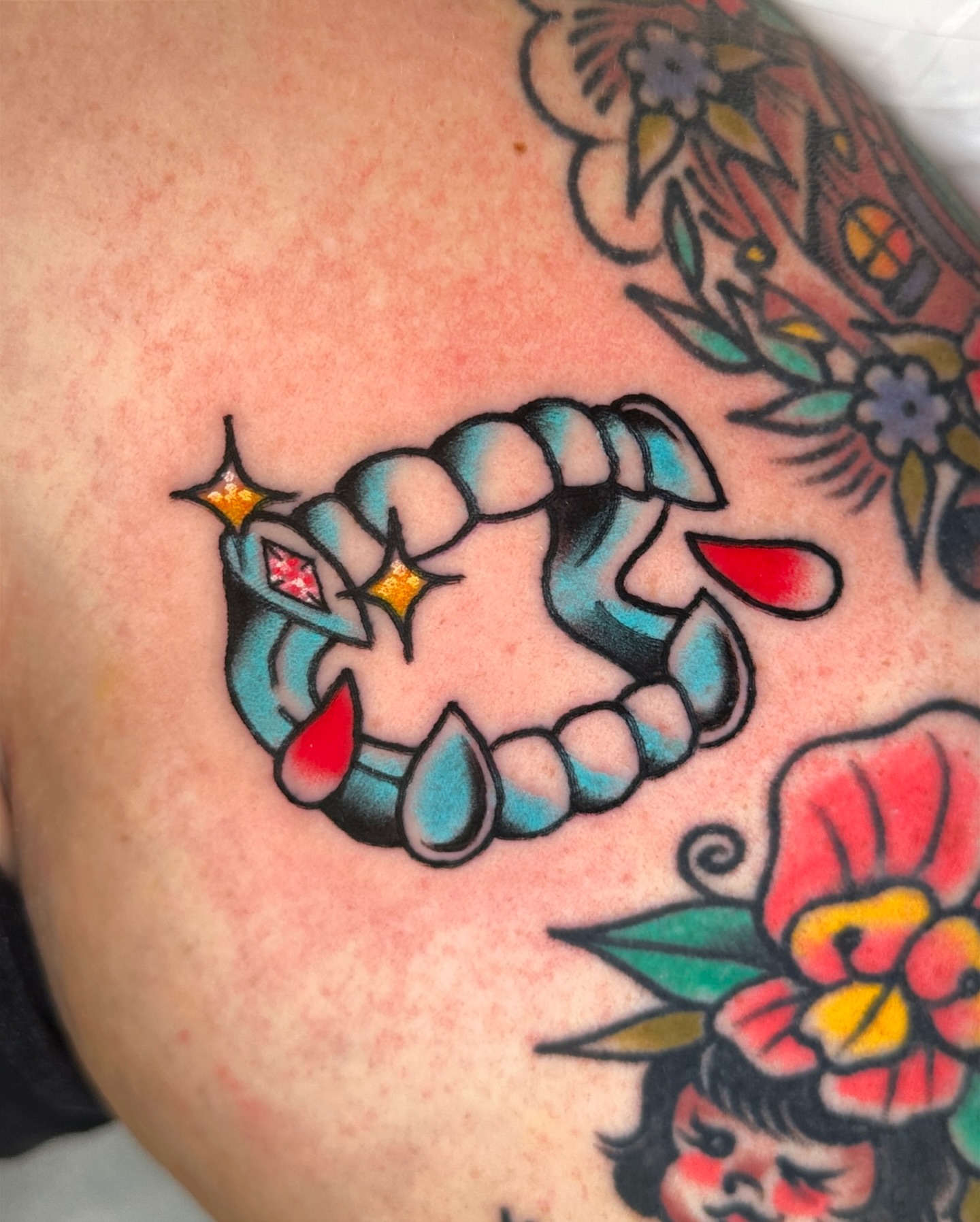 Clawed hand American traditional tattoo on the shoulder by Paige Ochoa