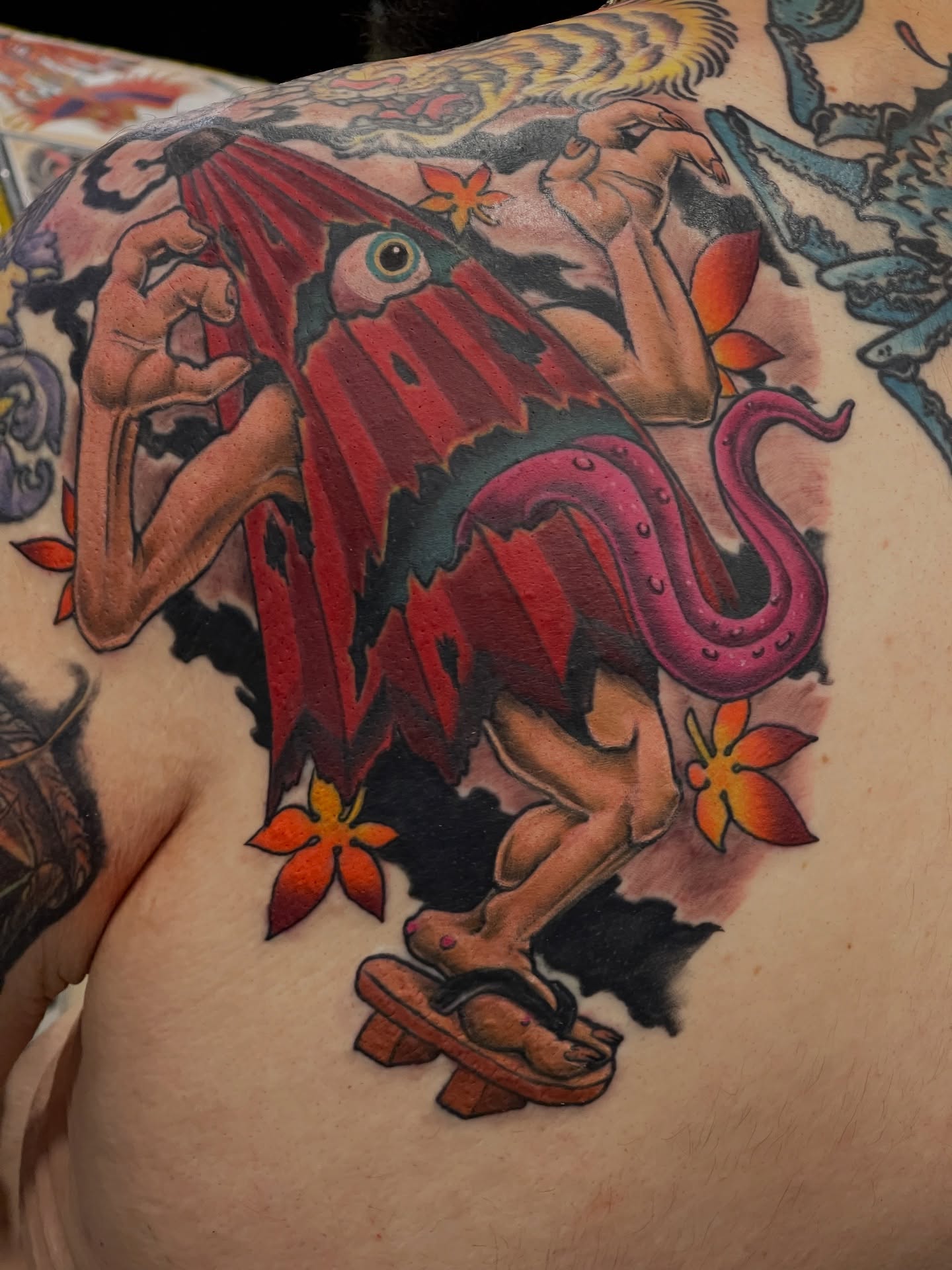 Squid and octopus American traditional tattoo on the back by Dale Callahan, Olympia, Washington