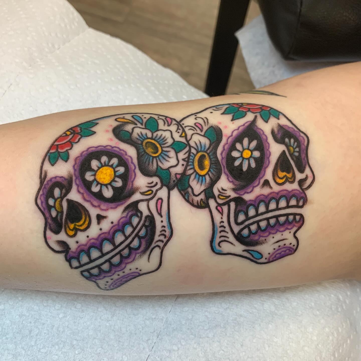 Sugar skulls American traditional tattoo on the forearm by Brandon Heredia, Vacaville, California