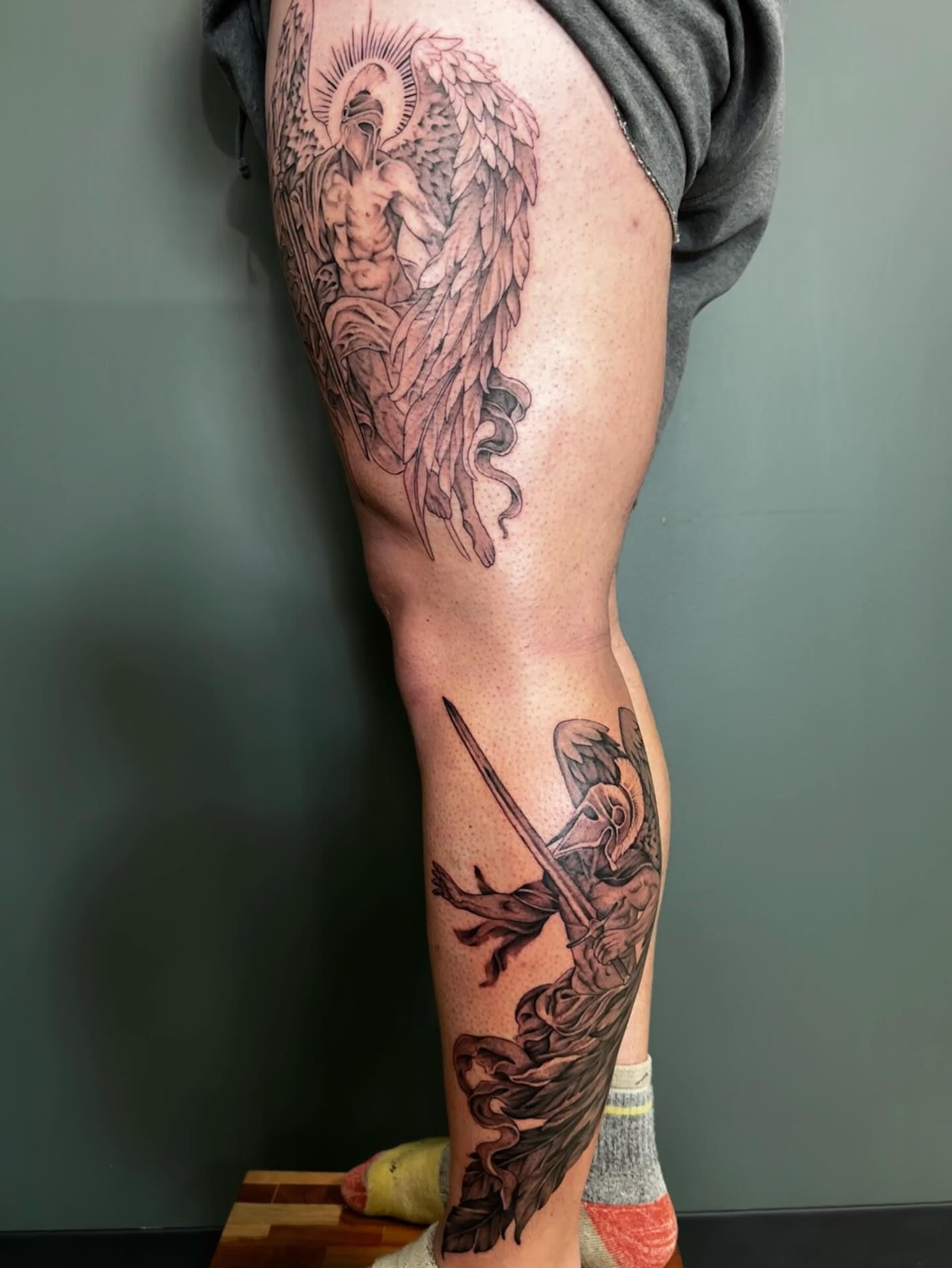 Angel and warrior realism tattoo on the leg by Sarah Margaret