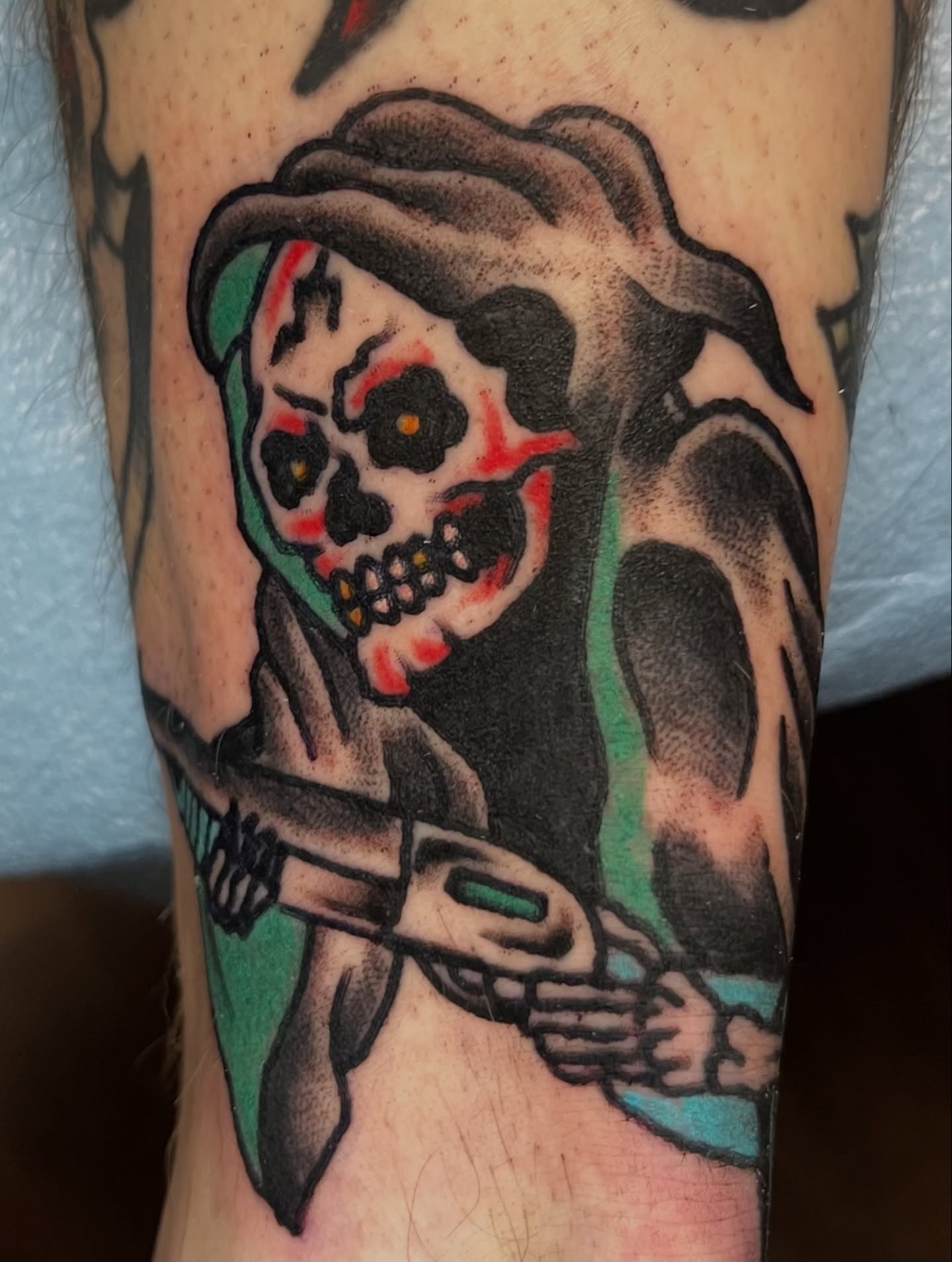 Skull with flowers American traditional tattoo on the forearm by You’ll save me in your phone as Tattoo Tim