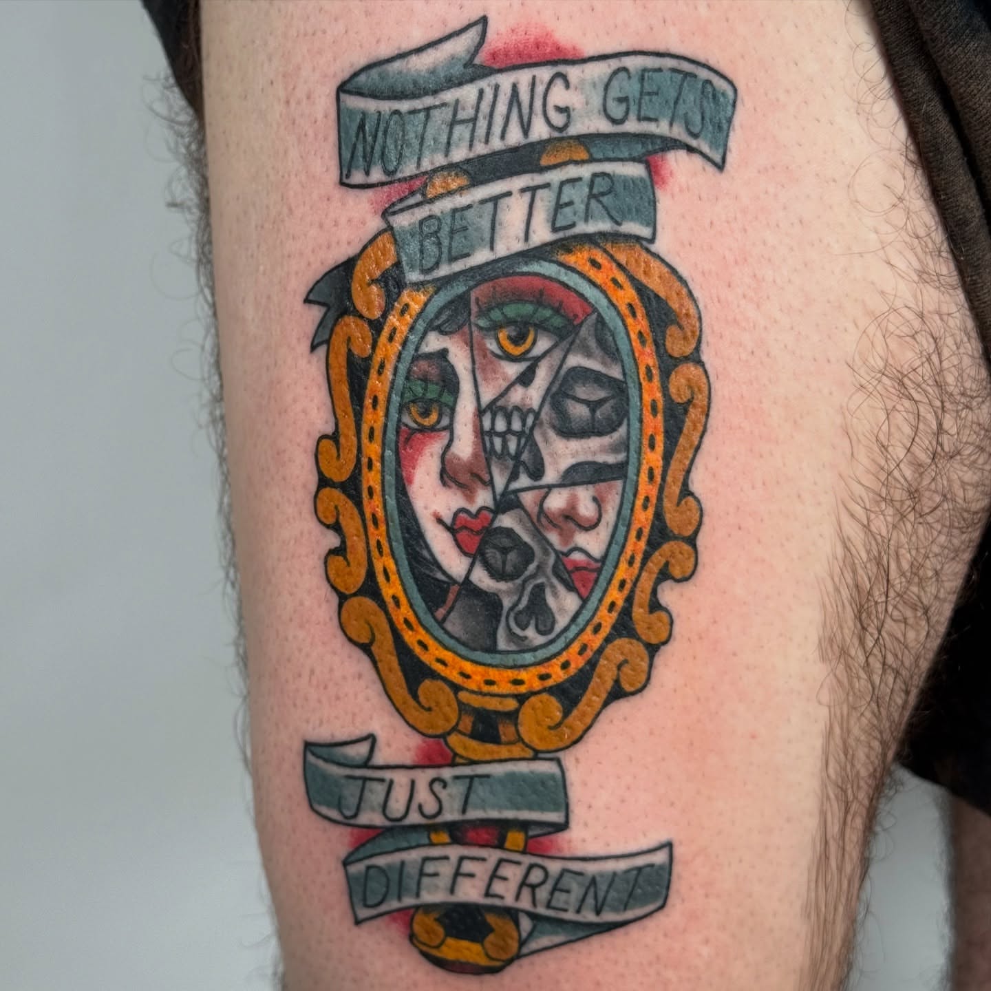 Mirror American traditional tattoo on the thigh by autumn sky