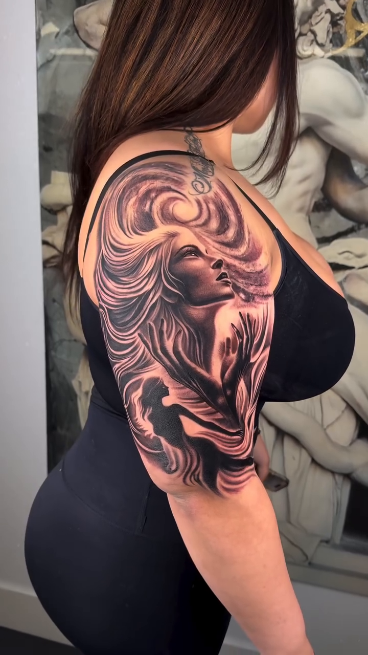 Woman with flowing hair realism tattoo by Fernando Andrade Jr