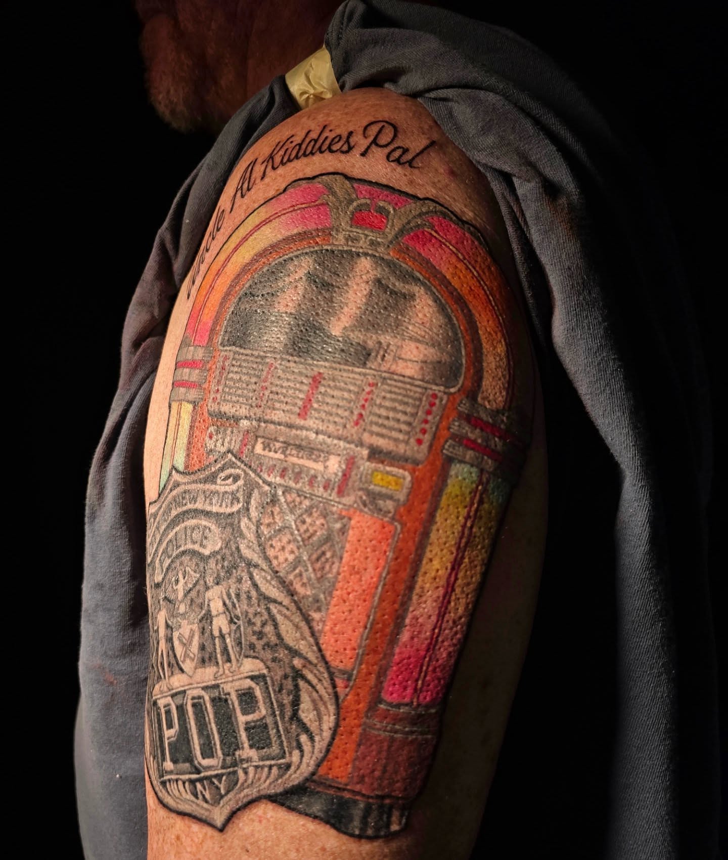 Jukebox realism tattoo on the shoulder by "Gentle"Jay Blondel
