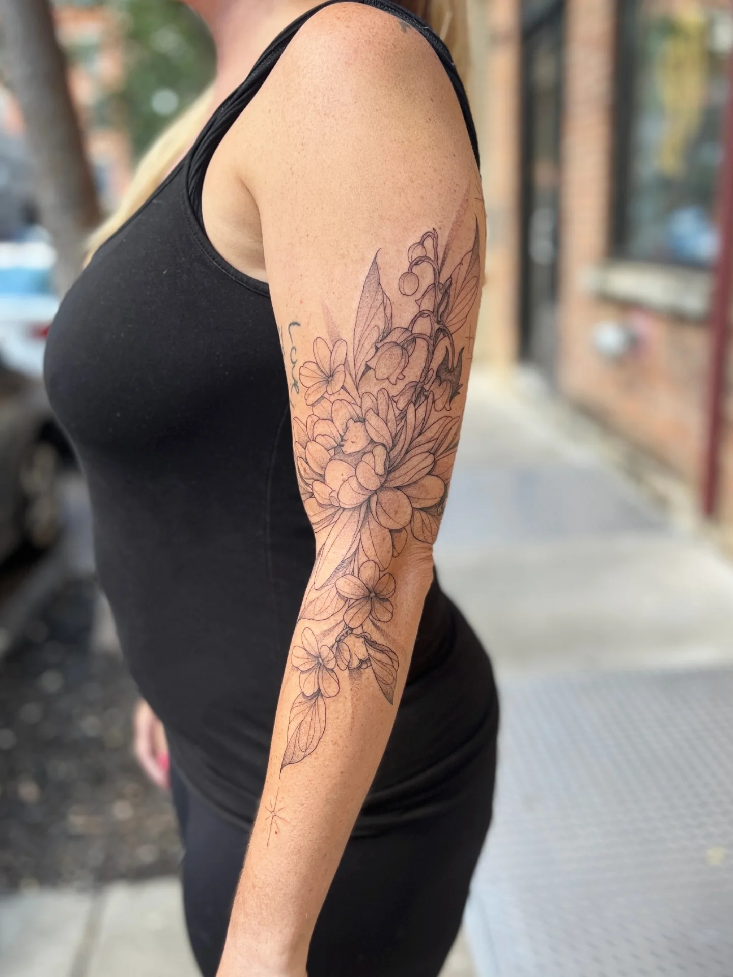 Floral bouquet black and grey tattoo on the forearm by Sophorn Long (soapy)