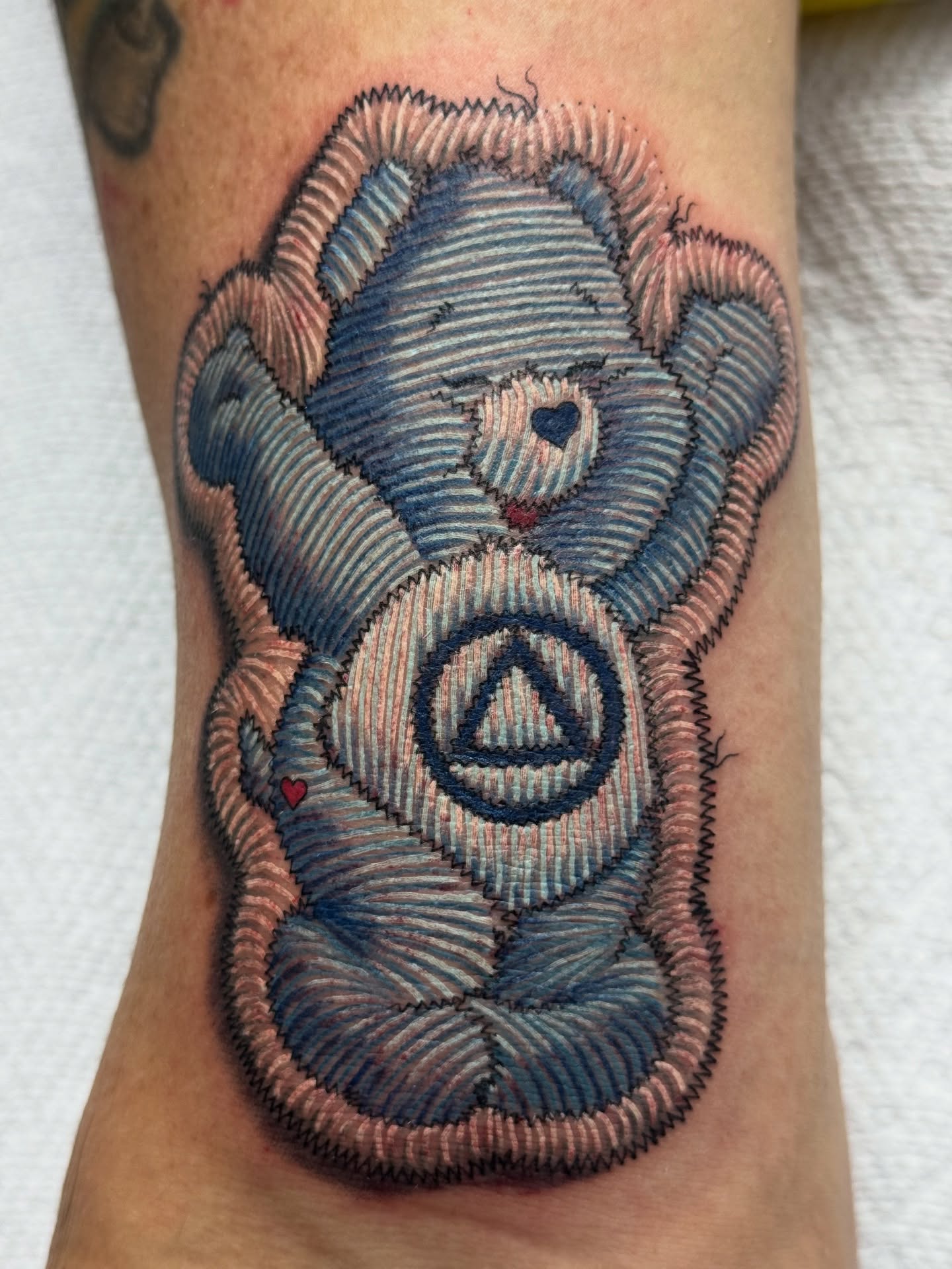 Teddy bear American traditional tattoo on the forearm by Lacee-Beth Finch