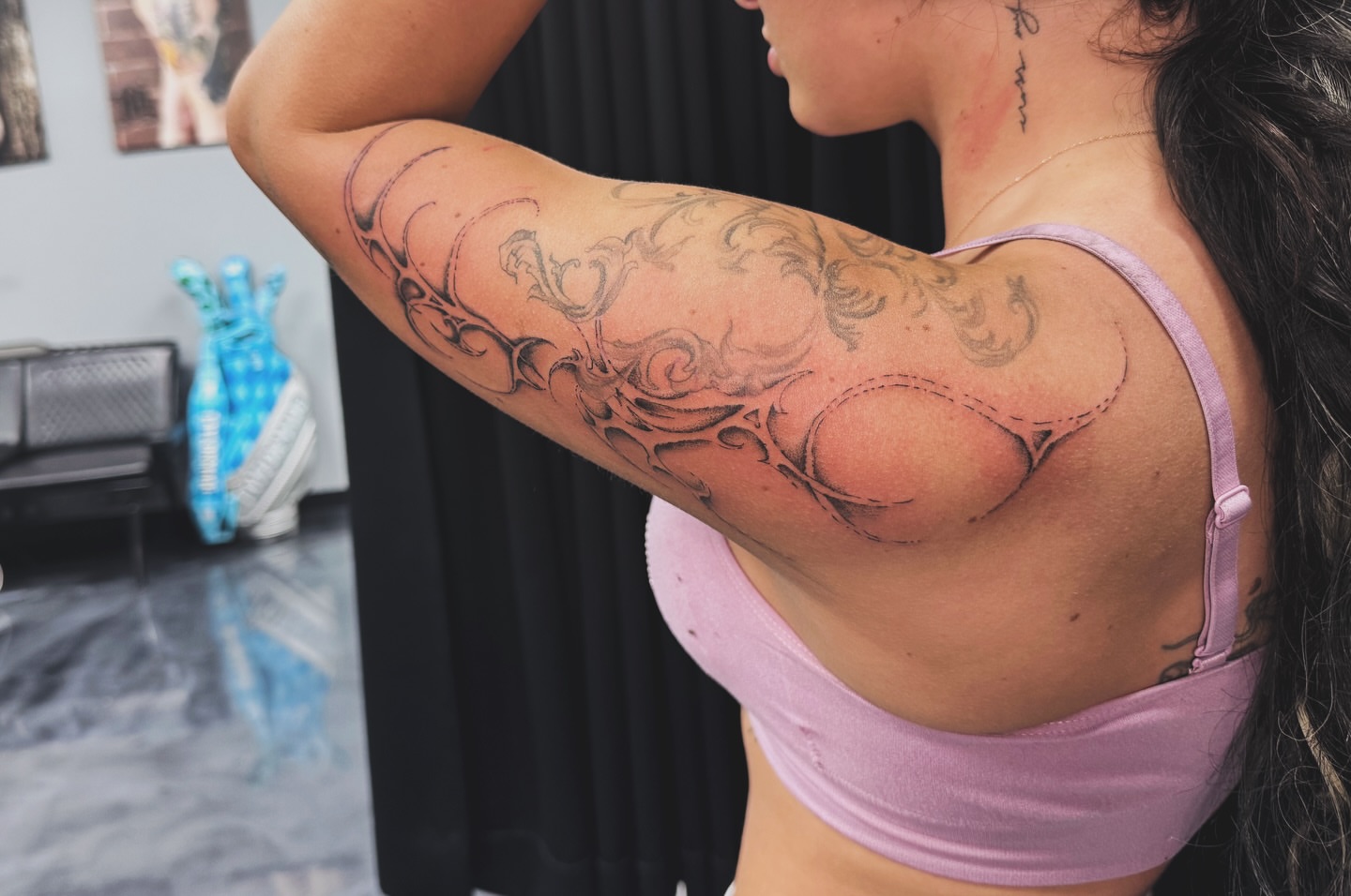 Breast black and grey tattoo on the upper arm by Marie Amor🌙