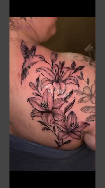 Lily and hummingbird tattoo fine line tattoo on the chest by Mi♥️Amor♥️Ink