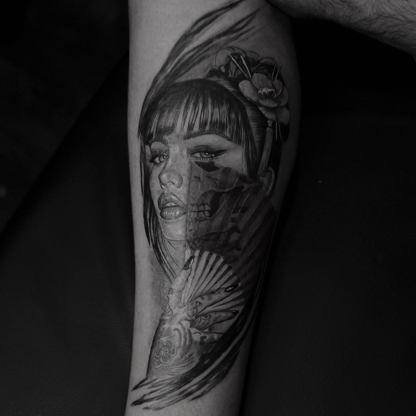 Woman with floral hairpiece realism tattoo on the forearm by Romi Utah Tattoo
