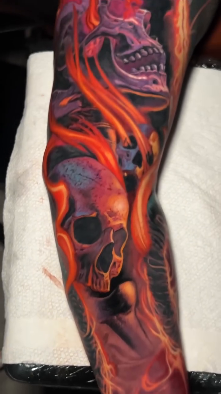 Skulls and flames realism tattoo by Sean Foy